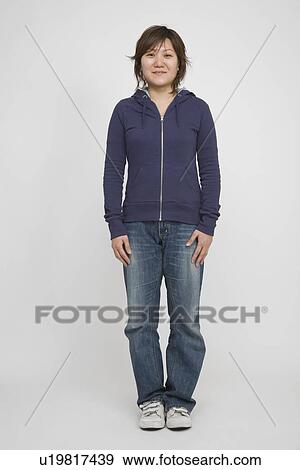 Stock Photo - Portrait of a mid adult woman standing. Fotosearch