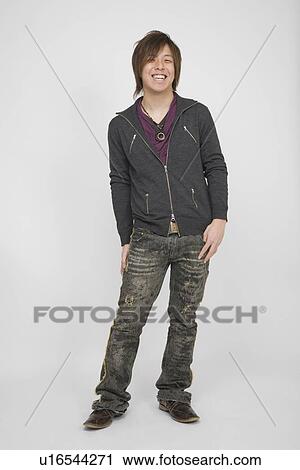 Portrait of a young man standing View Large Photo Image Stock Image - Portrait of a young man standing. Fotosearch