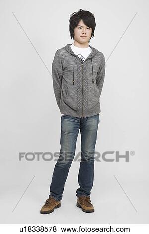 Portrait of a young man standing View Large Photo Image Stock Photo - Portrait of a young man standing. Fotosearch