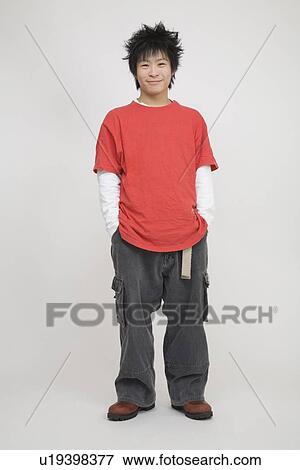 Portrait of a young man standing View Large Photo Image Stock Photo - Portrait of a young man standing. Fotosearch