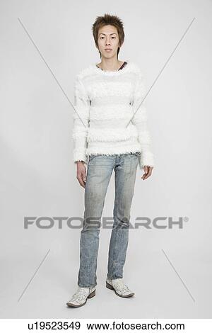 Stock Photo - Portrait of a young man standing. Fotosearch
