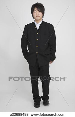 Stock Photo - Portrait of a young man standing. Fotosearch