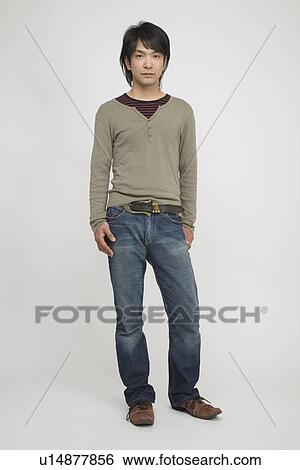 Portrait of a young man standing View Large Photo Image Stock Photograph - Portrait of a young man standing. Fotosearch