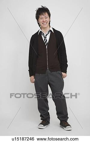 Stock Photograph - Portrait of a young man standing. Fotosearch