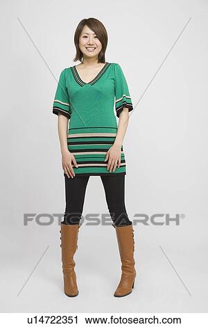 Portrait of a young woman standing View Large Photo Image Stock Image - Portrait of a young woman standing. Fotosearch