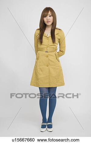 Portrait of a young woman standing View Large Photo Image Stock Image - Portrait of a young woman standing. Fotosearch