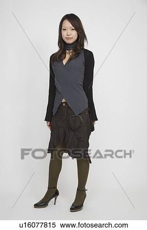 Portrait of a young woman standing View Large Photo Image Stock Photography - Portrait of a young woman standing. Fotosearch