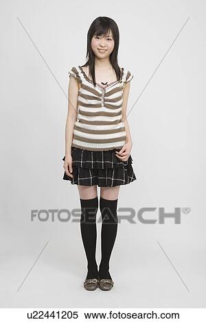Portrait of a young woman standing View Large Photo Image Stock Photography - Portrait of a young woman standing. Fotosearch