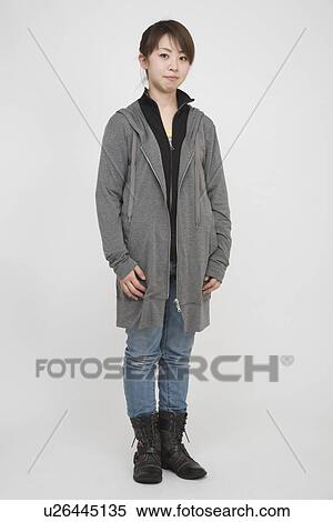 Portrait of a young woman standing View Large Photo Image Stock Photography - Portrait of a young woman standing. Fotosearch