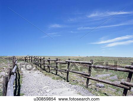 Picture - Gravel road and blue sky. Fotosearch