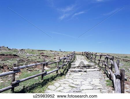 Stock Image - Path and blue sky. Fotosearch