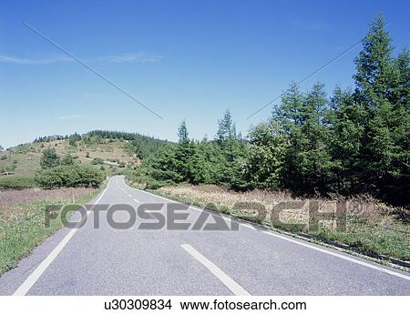 Road through mountain View Large Photo Image Picture - Road through mountain. Fotosearch