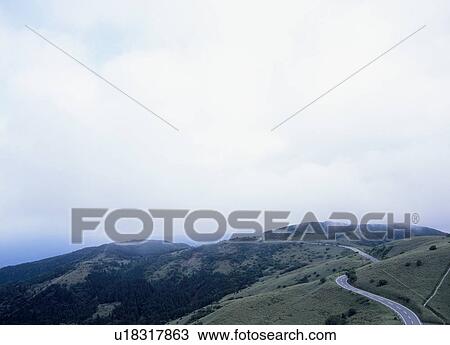 Road through mountain View Large Photo Image Stock Image - Road through mountain. Fotosearch