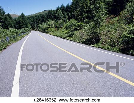 Road through mountain View Large Photo Image Stock Image - Road through mountain. Fotosearch