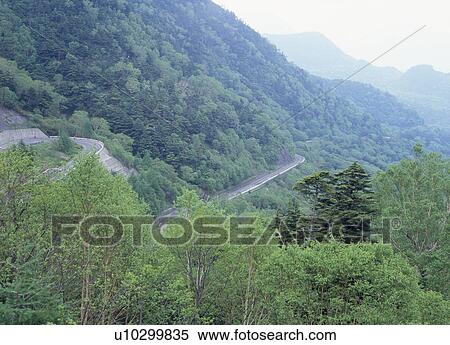 Stock Photography - Road through mountain. Fotosearch