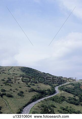Winding road through mountain View Large Photo Image Picture - Winding road through mountain. Fotosearch