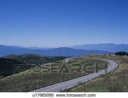 Stock Photography - Winding road through mountain. Fotosearch