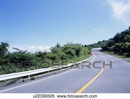 Stock Photography - Winding road through mountain. Fotosearch