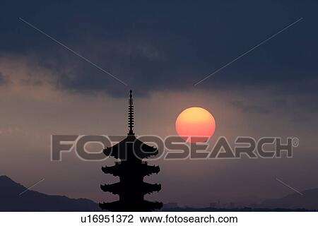 Stock Image - Five story pagoda with evening sun. Fotosearch