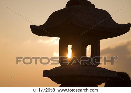 Stone lantern with evening sun View Large Photo Image Stock Photo - Stone lantern with evening sun. Fotosearch