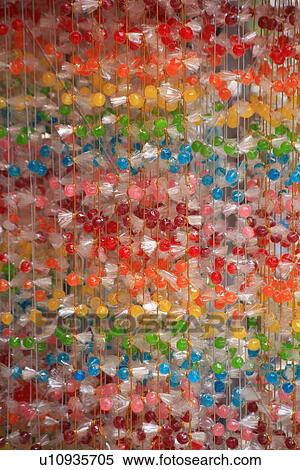 Strings of colorful candy View Large Photo Image Stock Photography - Strings of colorful candy. Fotosearch