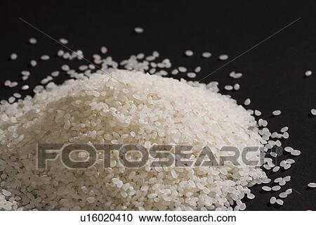 Uncooked polished white rice View Large Photo Image Stock Image - Uncooked polished white rice. Fotosearch