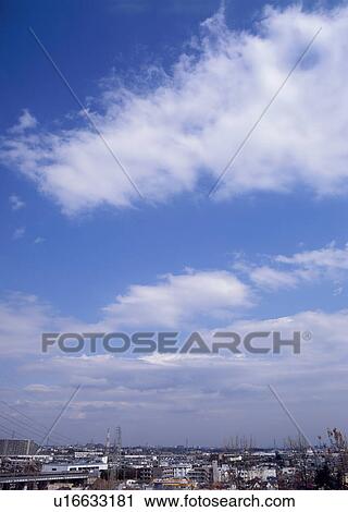 Stock Image - Altocumulus and cirocumulus clouds. Fotosearch