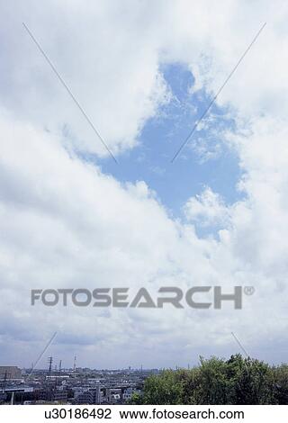Stock Image - Altocumulus and cirocumulus clouds. Fotosearch