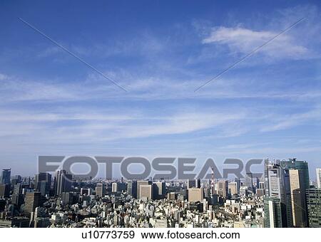 Stock Photo - Blue sky in the city. Fotosearch
