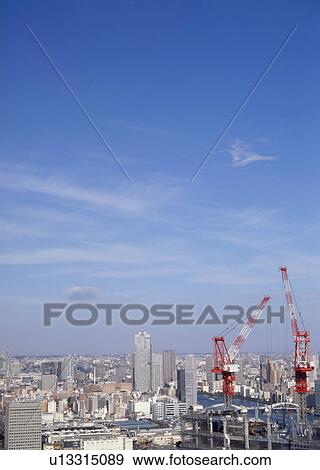 Stock Photo - Blue sky in the city. Fotosearch