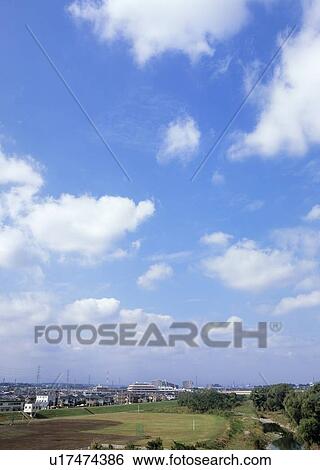 Stock Photograph - Cumulus clouds and sky. Fotosearch