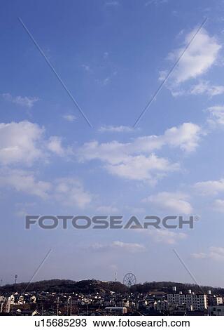Stock Image - Humilis and altocumulus clouds. Fotosearch
