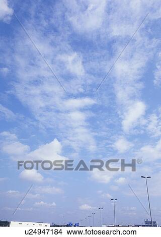 Picture - Humilis and cirrostratus clouds. Fotosearch