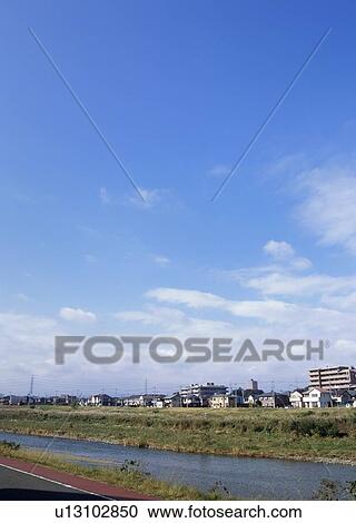 Stock Image - Humilis and cirrostratus clouds. Fotosearch