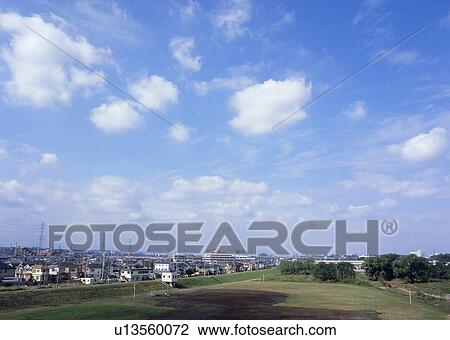 Stock Image - Humilis and cirrostratus clouds. Fotosearch