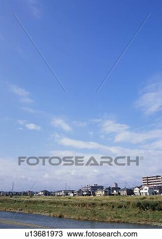 Stock Image - Humilis and cirrostratus clouds. Fotosearch