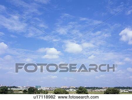 Stock Image - Humilis and cirrostratus clouds. Fotosearch