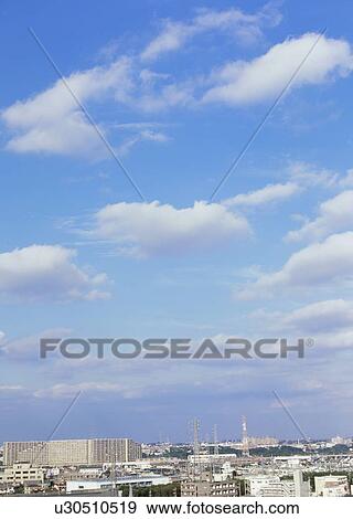 Stock Photo - Humilis and cirrostratus clouds. Fotosearch