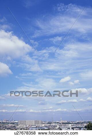 Stock Photo - Humilis, cirrostratus and cirrocumulus clouds. Fotosearch