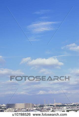 Stock Photograph - Humilis, cirrostratus and cirrocumulus clouds. Fotosearch
