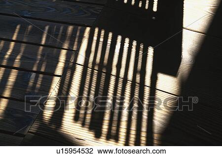Stock Image - Shadow on wooden board. Fotosearch