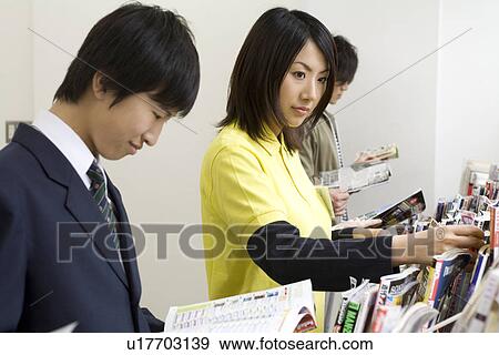 Stock Photo - Clerk and customer at convenience store. Fotosearch