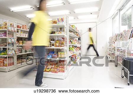Clerk at convenience store View Large Photo Image Stock Photograph - Clerk at convenience store. Fotosearch