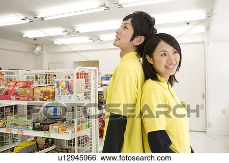 Convenience store clerk View Large Photo Image Stock Photograph - Convenience store clerk. Fotosearch