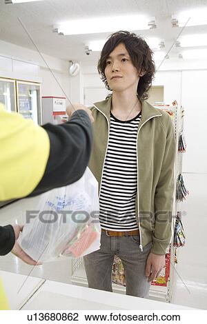 Customer at convenience store View Large Photo Image Stock Image - Customer at convenience store. Fotosearch
