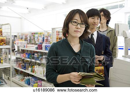 Customer at convenience store View Large Photo Image Stock Photograph - Customer at convenience store. Fotosearch