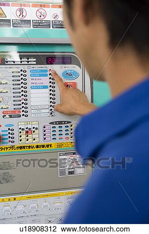 Gas station clerk operating machine View Large Photo Image Stock Image - Gas station clerk operating machine. Fotosearch