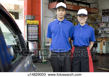 Stock Image - Gas station clerk standing. Fotosearch