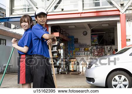 Stock Photography - Gas station clerk standing. Fotosearch