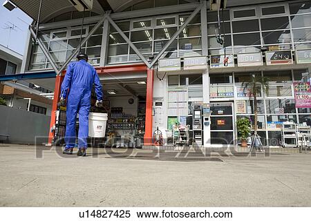 Gas station clerk walking View Large Photo Image Stock Photography - Gas station clerk walking. Fotosearch